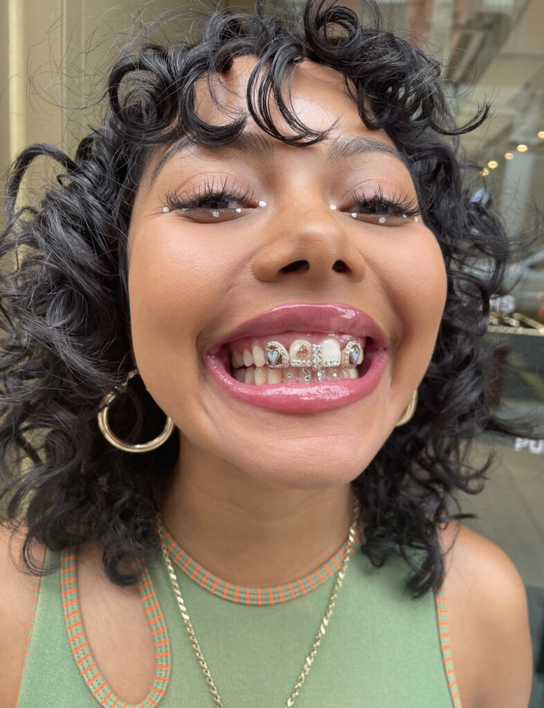 tooth charms applied at the M jewelers 