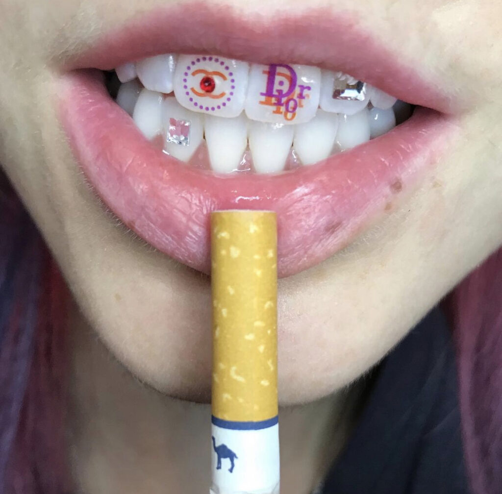 tooth tattoo done by tooth charm 